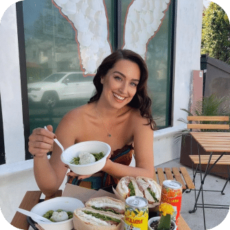 woman smiling with a bowl