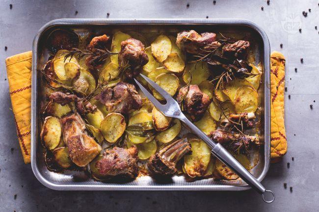 Baked kid with wild onions. Apulian dish for the holidays