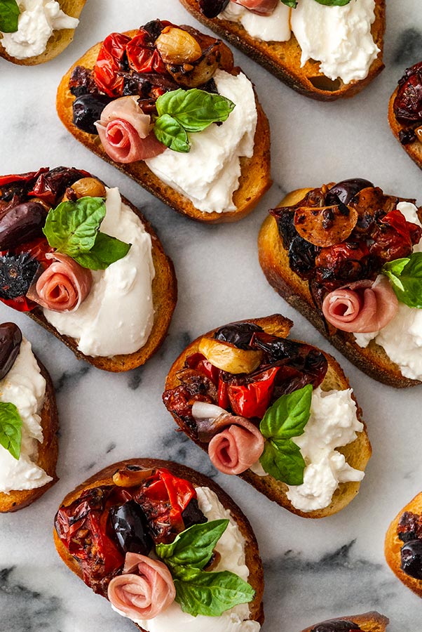 CROSTINI WITH FLOWERS OF PUMPKIN, BURRATA, AND ALICI