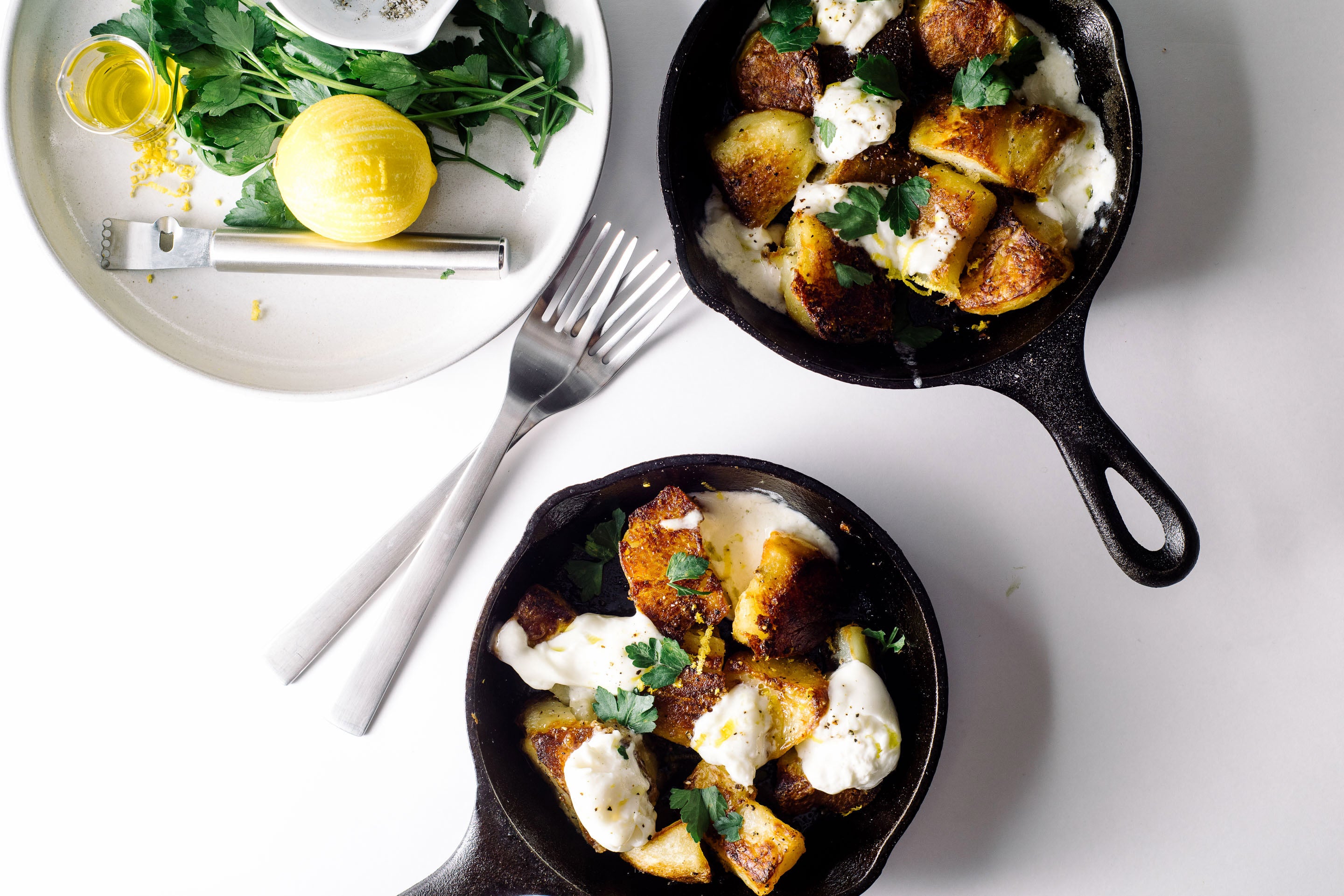 CRISPY POTATOES WITH BURRATA, TOMATO, AND PESTO